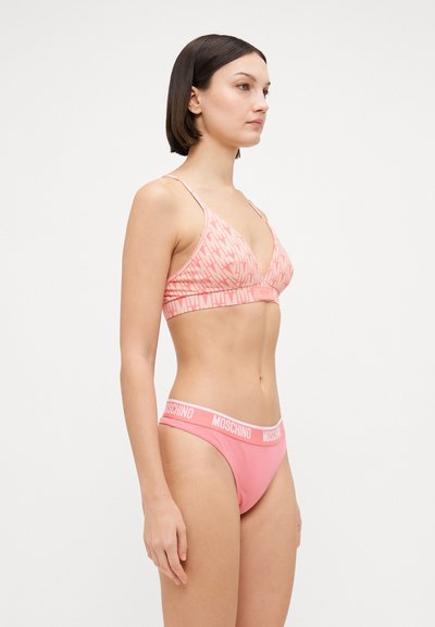 Pink bralette and bikini set featuring a triangular design, soft fabric, and elastic waistband with "Moschino" logo in contrasting color.