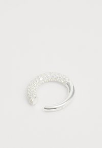 Silver ring featuring a curved design, embellished with clear crystals on the top half and smooth metal on the bottom half.
