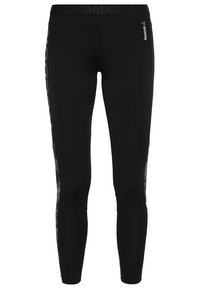 Czarne legginsy sportowe wykonane z elastycznego materiału, charakteryzujące się dopasowanym krojem, siateczkowymi panelami po bokach oraz dyskretnym logo Reebok w okolicy talii.