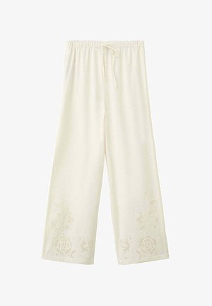 Pantalon large crème avec taille élastique, cordon de serrage et broderie en dentelle florale près des ourlets.