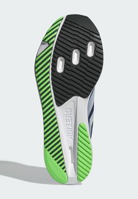 Athletic shoe sole with a textured black rubber base, green and black striped accents, and three ventilation holes. Features "ADIZERO" branding.