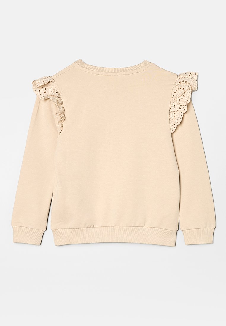 Sweatshirt beige avec des accents en dentelle sur les épaules, col rond, manches longues et poignets et ourlet côtelés. Texture lisse.