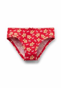 Biancheria intima di cotone rossa con stampa di omino di pan di zenzero e scritta "HO". Vita elastica con un piccolo fiocco decorativo sul davanti. Tessuto morbido.
