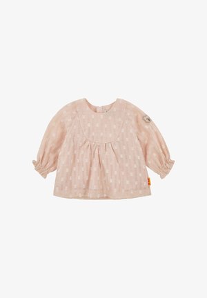 Blusa de manga larga rosa claro con tejido texturizado, mangas fruncidas y escote redondeado. Presenta un sutil patrón de cuadros y un detalle de oso.