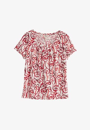 Fehér rövid ujjú női blúz piros és rózsaszín absztrakt virágmintával, kerek nyakkivágással és kis pliszé díszítéssel.