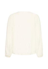 Blouse blanche à manches longues avec un col rond et des poignets élastiques, vue de dos sur fond blanc.