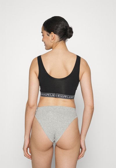Black ribbed crop top with logo band and gray cotton high-waisted brief, smooth texture, fitted design, and scoop neckline.
