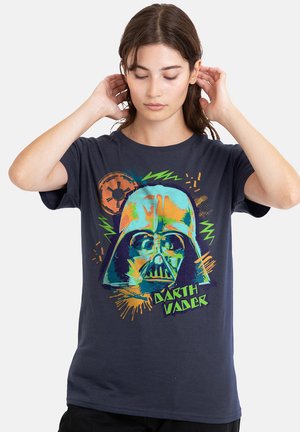 Navy blue cotton t-shirt featuring a colorful graphic print of Darth Vader's helmet with neon green and orange accents.