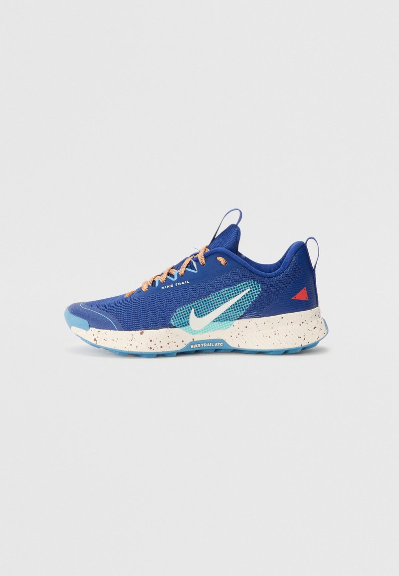 Blue trail running shoe featuring a textured mesh upper, speckled midsole, turquoise accents, and light brown laces. Midsole text is visible.