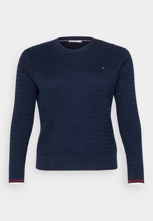 Navy blue knitted sweater with a textured pattern, round neckline, and long sleeves. Features contrasting striped cuffs and small logo detail.