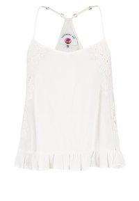 Top blanco sin mangas con tejido texturizado, detalles de encaje en los hombros y un dobladillo con volante. Tirantes ajustables y etiqueta de la marca en la parte posterior.