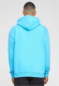 Karl Kani Jersey con capucha - light blue