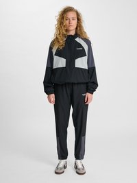 Hummel Teplákové kalhoty - black