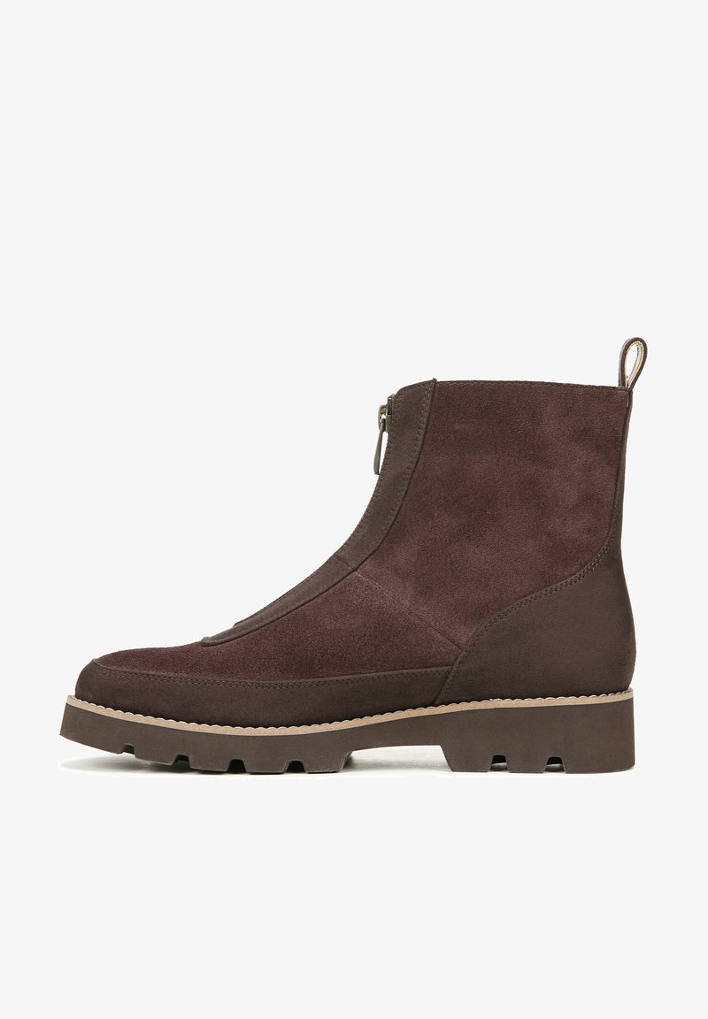 Brown suede ankle boot with side zipper, textured surface, and a chunky outsole with a rugged tread pattern. Features a rear pull tab.