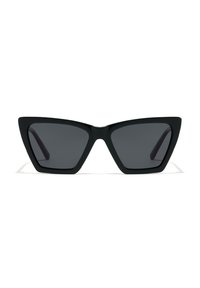 Cat-eye sunglasses with a matte black frame, dark tinted lenses, angular design, and sleek, pointed tips on the frame edges.