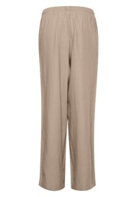Pantalon beige coupe ample avec taille élastique et jambes droites, réalisé dans un tissu léger.