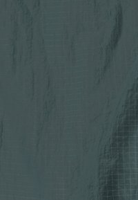 Dark gray ripstop fabric with a grid pattern of thin blue lines and a slightly shiny, textured surface.