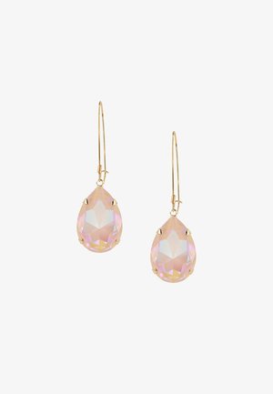 Gold-tone teardrop earrings with large, faceted pink crystals. Crystals are set in prong settings, featuring a smooth, polished surface.