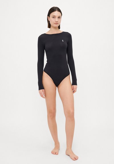 Black long-sleeve bodysuit with a round neck, high-cut legs, and a small logo on the chest. Smooth fabric with a fitted design.