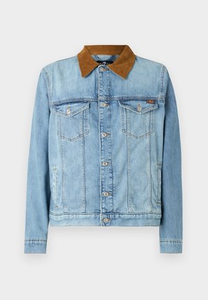 Helehelesinine teksajakk pruunist korduroost kraega, kahe rinna-taskuga, nööpkinnitusega ja pikkade varrukatega. Veidi kulunud tekstuur.