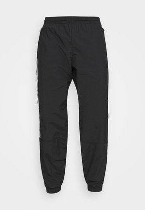 Zwarte lichte joggerbroek met elastische tailleband en boorden, met subtiele zijstreepdetails.