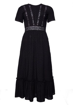 Black midi dress with short sleeves, lace inserts on bodice and waist, textured dot fabric, and ruffled hem.