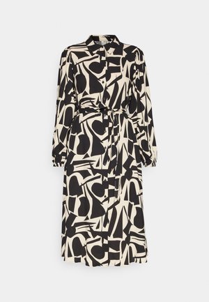 Button-up dress featuring a black and cream abstract pattern, long sleeves, a waist tie, and a straight cut with a below-the-knee hem.