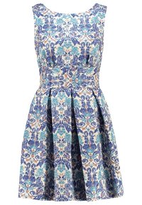 Bloemenjurk in blauw, teal en oranje patronen op een crème achtergrond. Mouwloos ontwerp met geplooide rok en aansluitend lijfje.