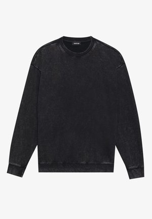 Black sweatshirt made from cotton with a faded, textured finish. Features long sleeves, a round neck, and ribbed cuffs and hem.