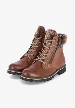 Braune Leder-Stiefeletten mit Kunstfellfutter, runder Zehenpartie, robuster schwarzer Gummisohle und dekorativem seitlichem Reißverschluss mit metallischem Akzent.