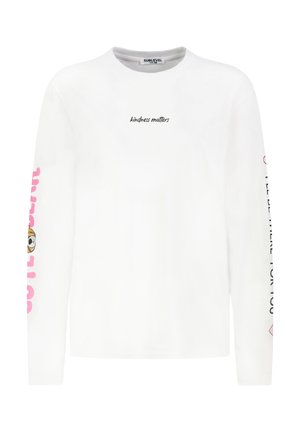 White long-sleeve T-shirt with "kindness matters" text on the front, pink graphics on sleeves, and a round neckline. Soft cotton material.
