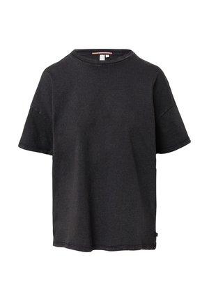 Schwarzes Baumwoll-T-Shirt mit rundem Halsausschnitt, kurzen Ärmeln und lässiger Passform. Hervorzuhebende Merkmale sind sichtbare Nähte und ein seitliches Etikett.