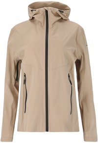 Veste imperméable beige avec une fermeture éclair sur le devant, capuche ajustable et deux poches latérales zippées ; matériau lisse et design ajusté.