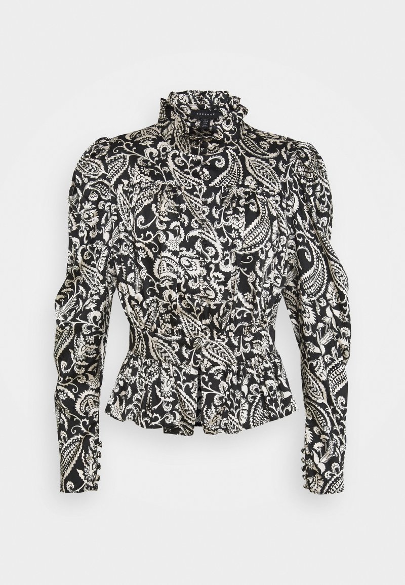Blouse à manches longues imprimée paisley noir et blanc, avec col haut volanté, épaules bouffantes, taille cintrée et poignets à boutons.