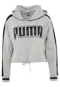 Felpa grigia cropped con dettagli neri, orlo con cordino e grande logo "PUMA" nero sul davanti. Tessuto morbido e maniche lunghe.