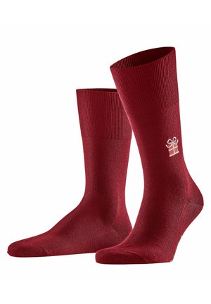Red knitted socks with a ribbed cuff. Features a subtle gift box logo in white on the side. Smooth texture, mid-calf design.