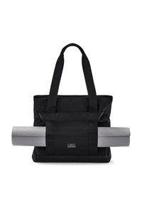 Borsa tote nera in tela con due manici corti e una tasca con zip, accompagnata da un tappetino da yoga grigio fissato con cinghie. Design semplice, materiale resistente.