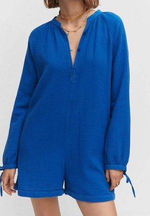 Combinaison en coton bleue à manches longues, patte de boutonnage et accents avec liens aux poignets. Texture douce et coupe décontractée, avec un décolleté en V profond.