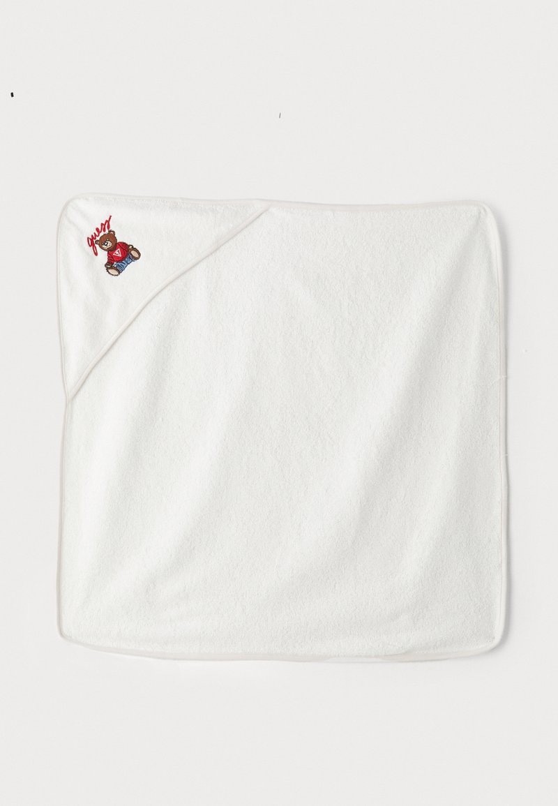 White hooded towel made of soft, absorbent material. Features a stitched bear design and contrasting trim on one edge.