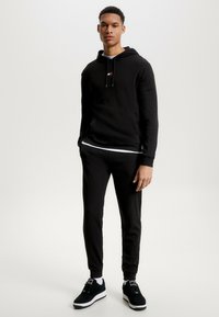 Tommy Jeans HERITAGE BADGE - Pyjamasbukse - black