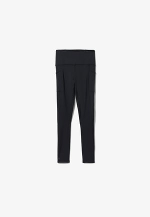Schwarze Leggings aus dehnbarem Stoff, mit hohem Bund, zwei Seitentaschen und einem schlanken, figurbetonten Design.