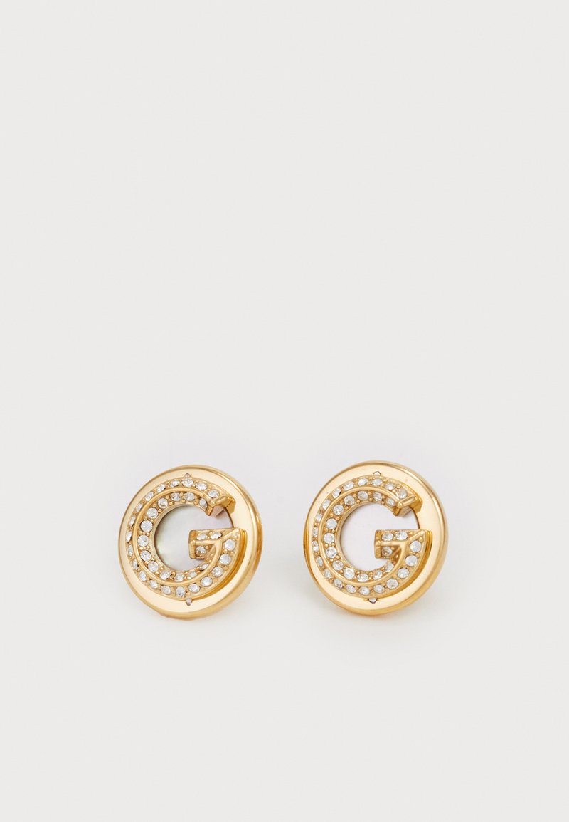 Gold-tone earrings featuring a circular design with a prominent letter 'G' embellished with clear rhinestones around the edge.