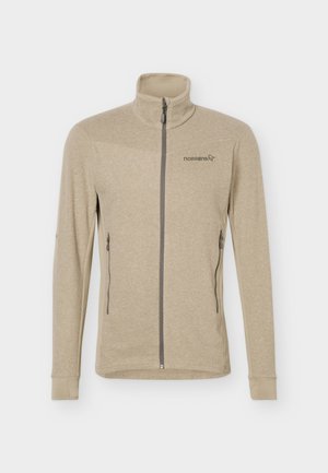Lys beige fleecejakke med hel glidelås, høy krage, glidelåslommer på sidene og "Norrøna"-logo på venstre bryst.