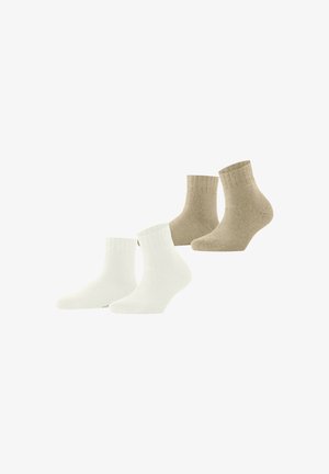 Quatre paires de chaussettes mi-mollet : deux blanches et deux beiges, en mélange de coton doux avec des poignets côtelés, présentant un design classique.