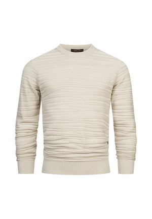 Pull crème en tricot avec un motif de vagues texturé, col rond et bords côtes aux poignets et à l'ourlet. Fabriqué dans un tissu doux et extensible.