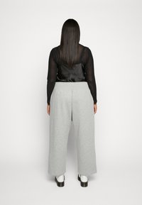 Nike Sportswear Träningsbyxor - grey