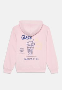 Felpa rosa con un design grafico che presenta un'illustrazione di una bevanda e testo in francese. Tessuto morbido, maniche lunghe e cappuccio spazioso.