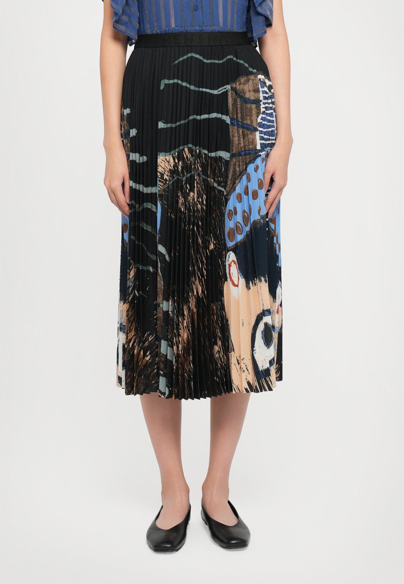 Pleated skirt with a black base, featuring a colorful abstract print of blue, brown, and red. Fabric appears lightweight and textured.