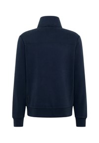 Navy blue sweater with a high collar, ribbed cuffs, and hem. Smooth fabric; features a logo on the left sleeve. Back view shown.