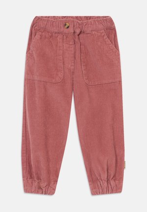 Kordfløyelsbukser i støvet rosa med elastisk midje, knapp foran, to framlommer og rynkede mansjetter ved ankler.